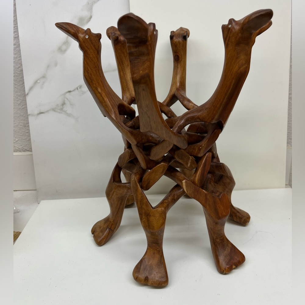 Wooden camel decoration. It can hold a plant or a bowl